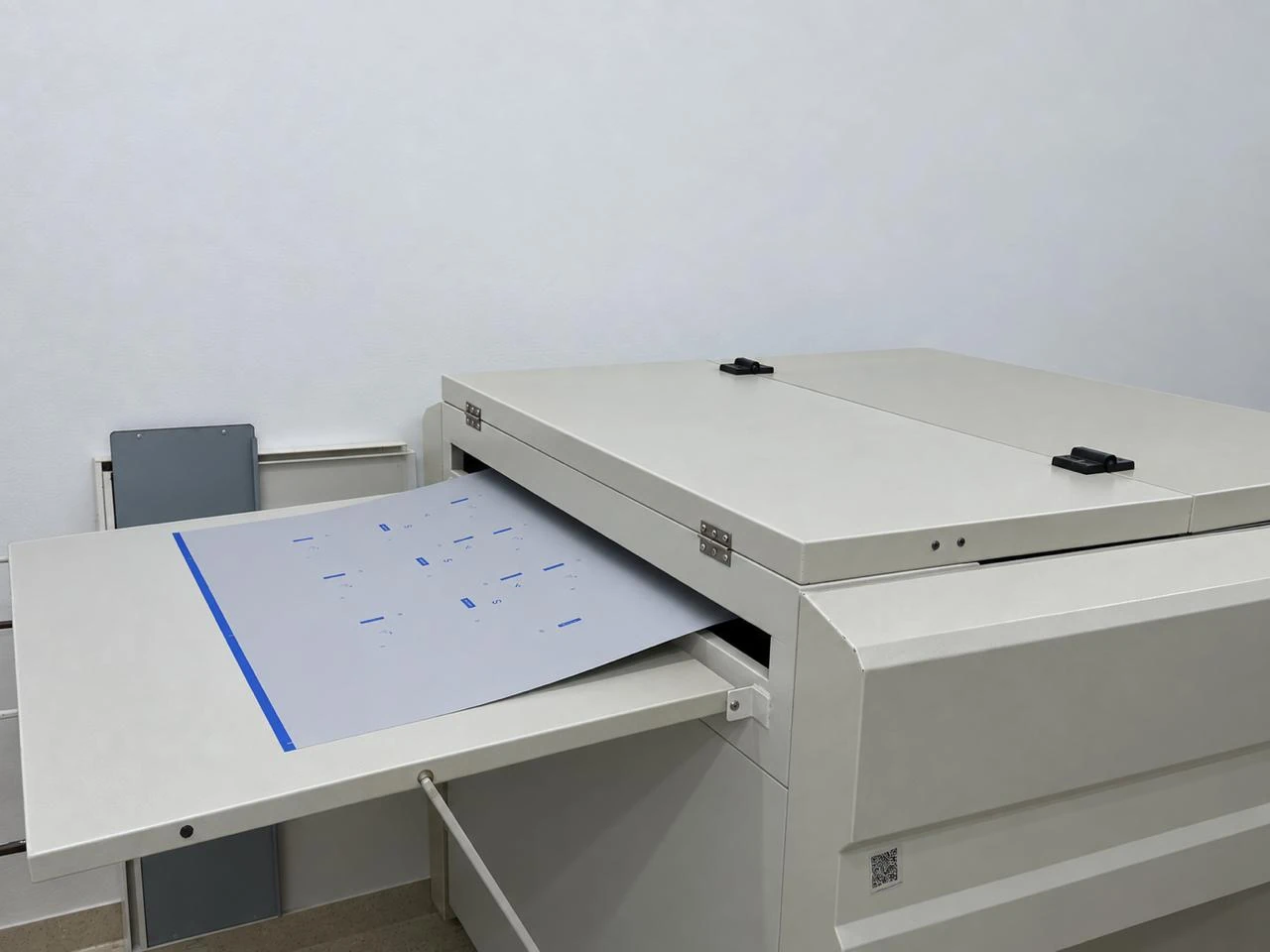 Processed printing plate with visible image areas.