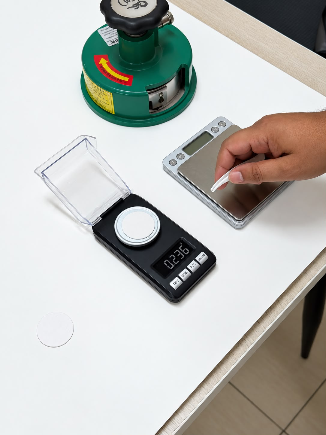 Weighing a board sample on a precision scale